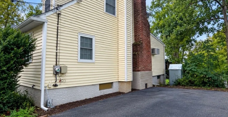 Same vinyl siding after soft washing, clean